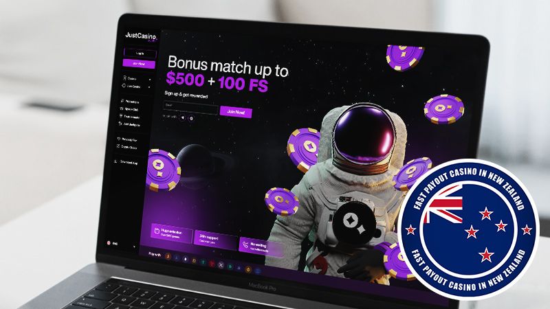 JustCasino.io main page with New Zealand badge on laptop