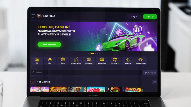 Playfina Casino Live Poker page on laptop